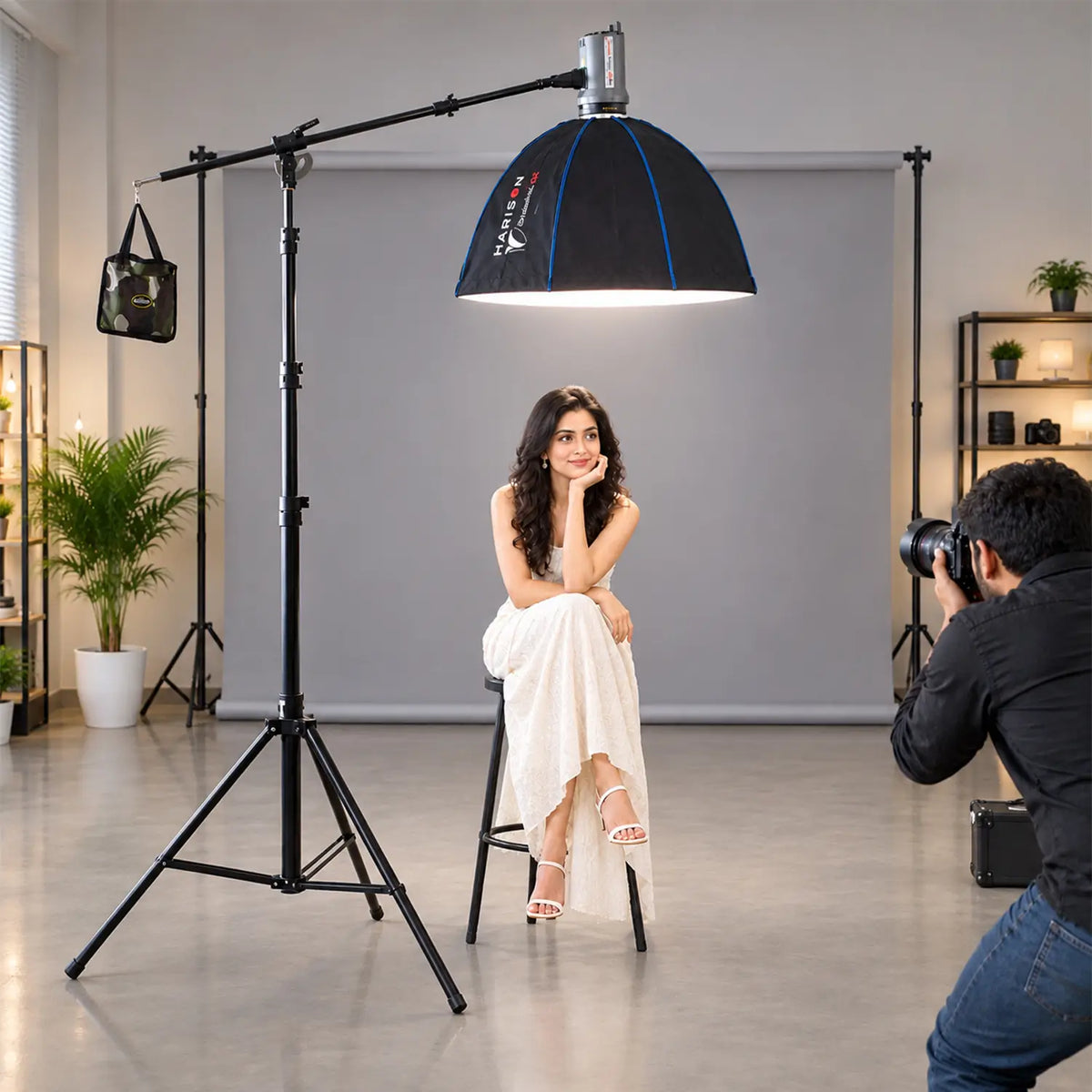 desc: The Harison Bahubali Boom Stand and Boom Arm support a heavy studio light with the Octa 80 softbox overhead. Engineered for high load-bearing capacity, this setup ensures stability, convenient positioning, and portability for professional top-lighting applications.
